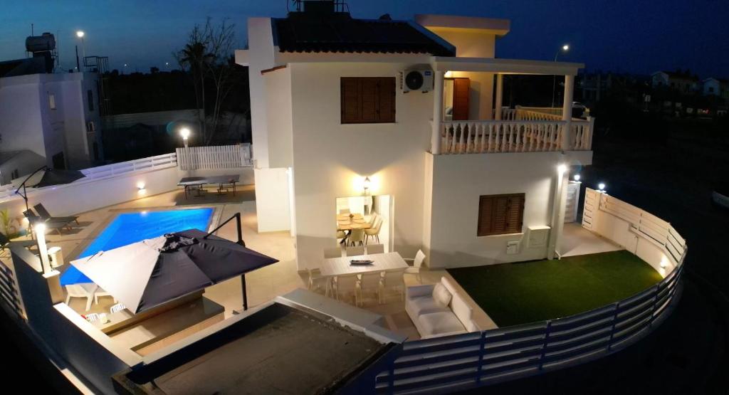 Celestial Villa and its private pool illuminated at dusk